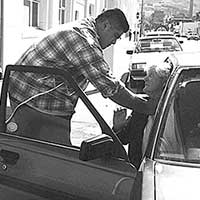Self-defence scenario beside a vehicle
